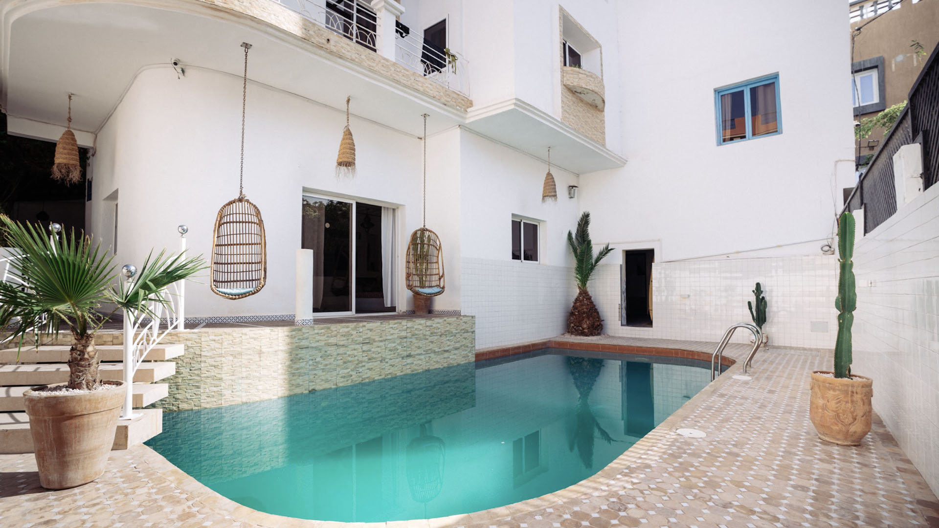 Summer at Solid Surf House Taghazout – guests relaxing by the pool between surf sessions