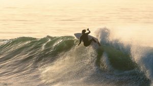 Winter surfing in Morocco – powerful wave at Killer Point Taghazout with dramatic winter sky