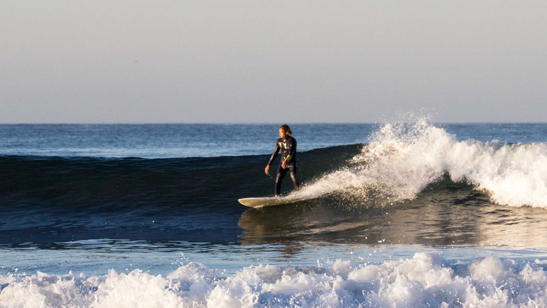Surfer demonstrating consistent, quality technique on a point break